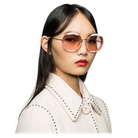 Miu Miu Reveal glitter eyewear